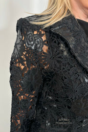 Close-up of a vegan leather lace blazer