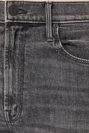 Zoom in view of a person wearing gray high-rise, straight leg, and cropped ankle-length hem
