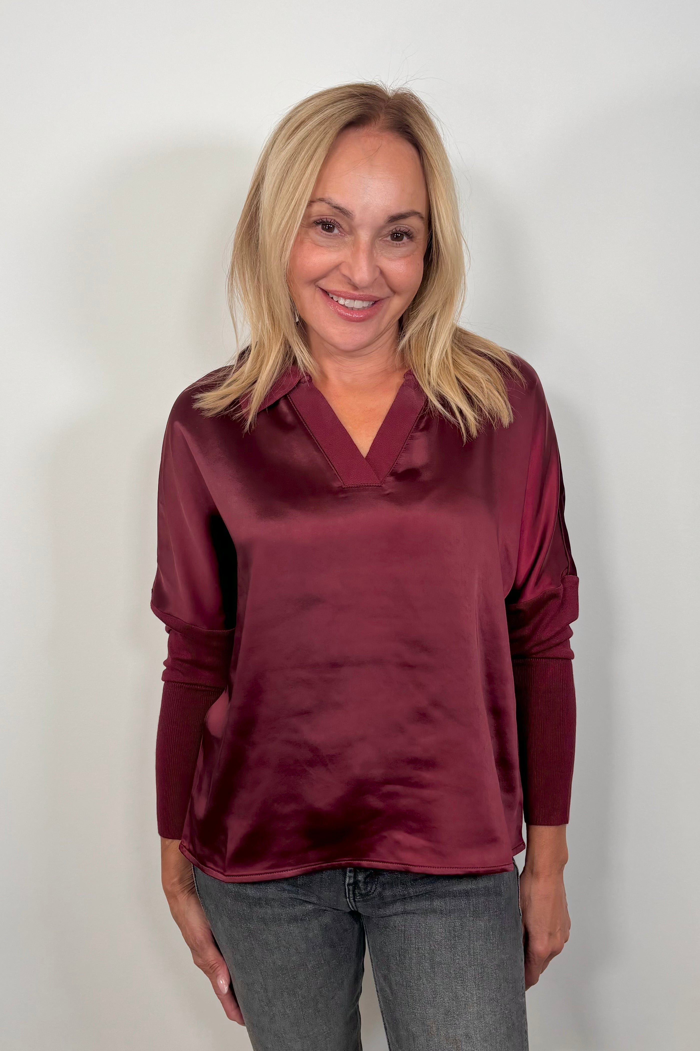 Woman wearing a wine red mix satin lingerie sleeve top