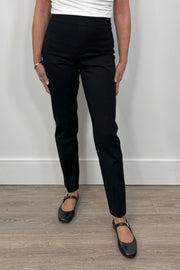 woman wearing a black compression straight leg pant