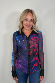 Woman wearing a blue and red long sleeve mesh shirt