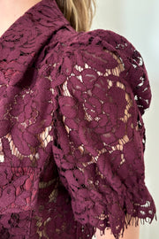 Close-up of a button down short sleeve lace blouse