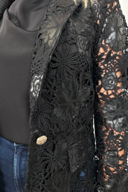 Close-up of a vegan leather lace blazer