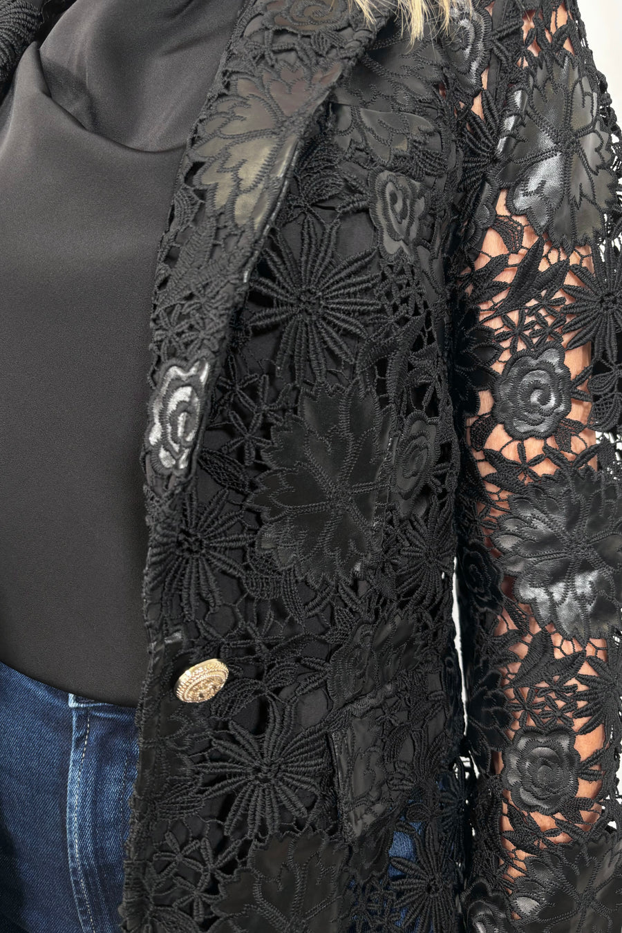 Close-up of a vegan leather lace blazer