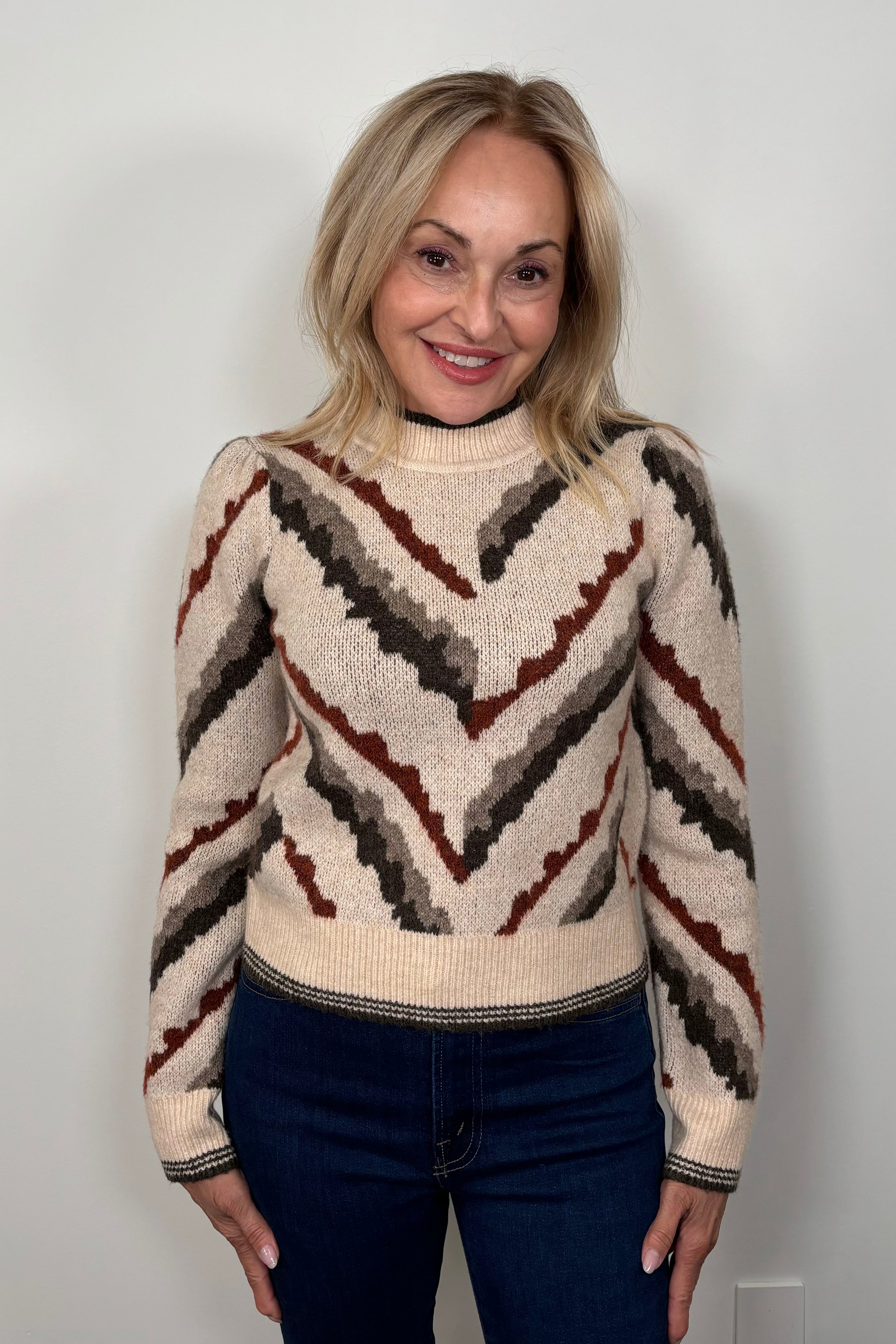 Front view of woman wearing a jacquard pattern sweater