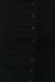 close-up of a black rouched front knit top
