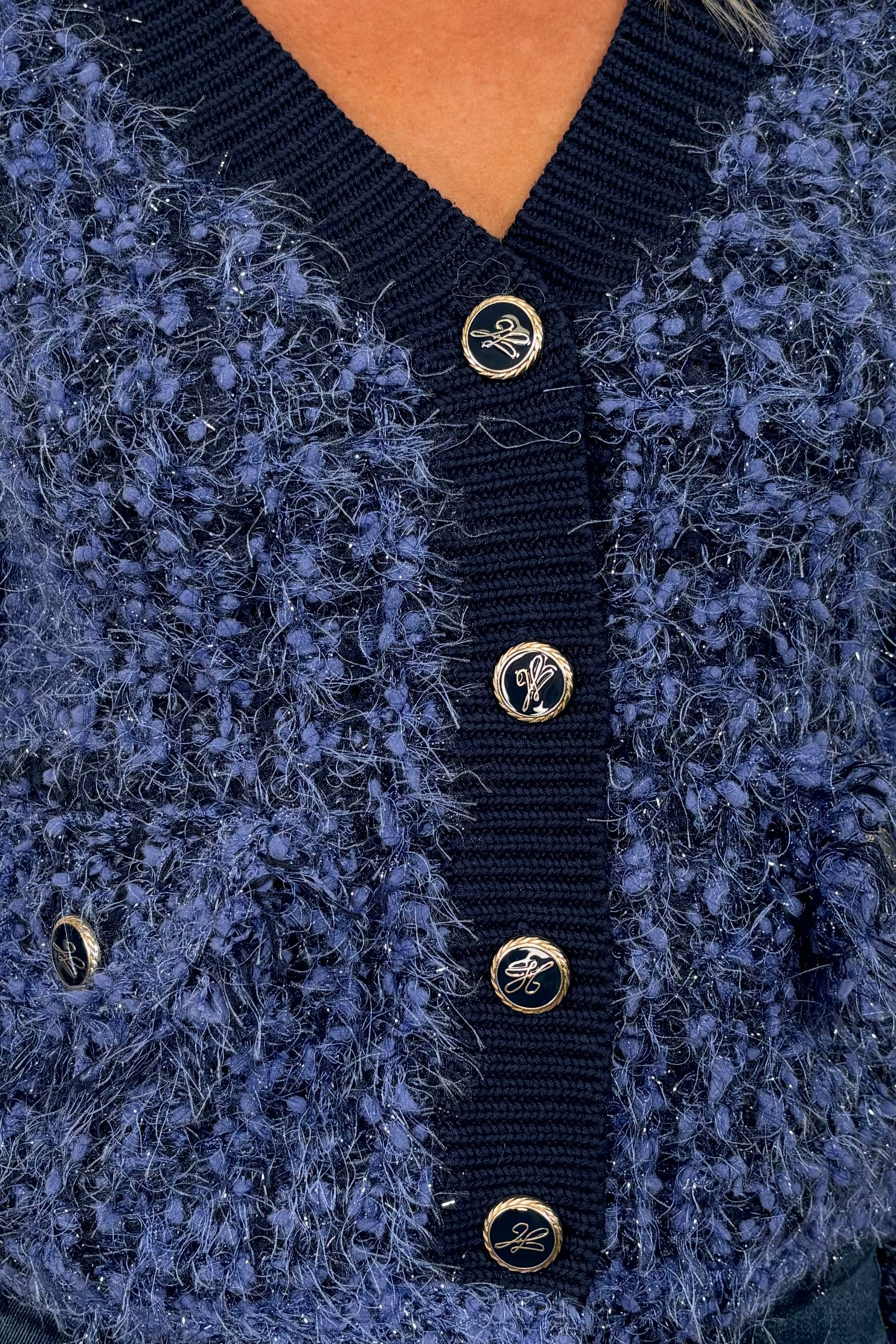 Close-up of blue fluffy cardigan
