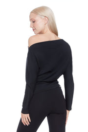 Side view of woman wearing a soft cowl neck rouched long sleeve top in Black