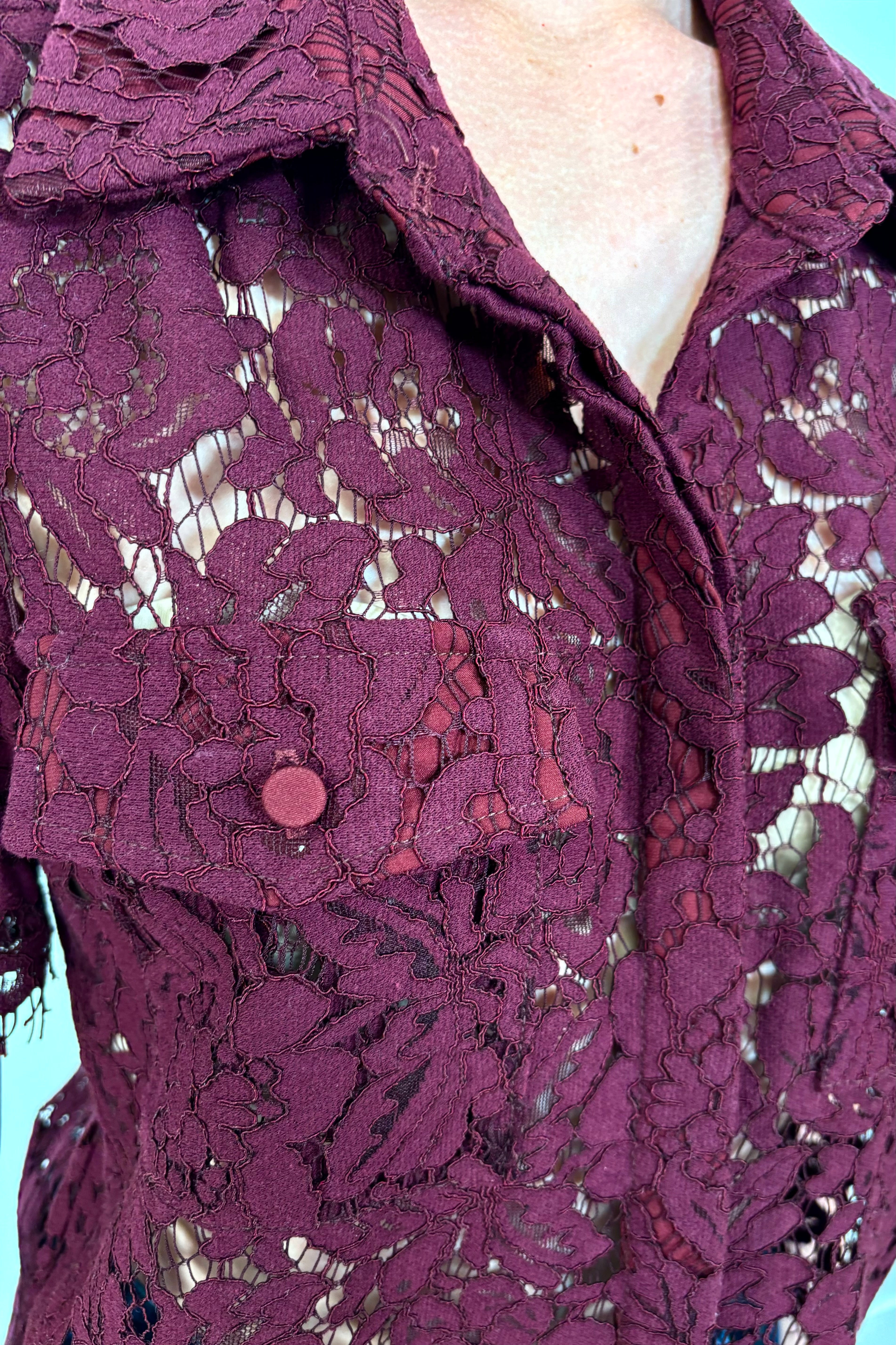 Close-up of a button down short sleeve lace blouse