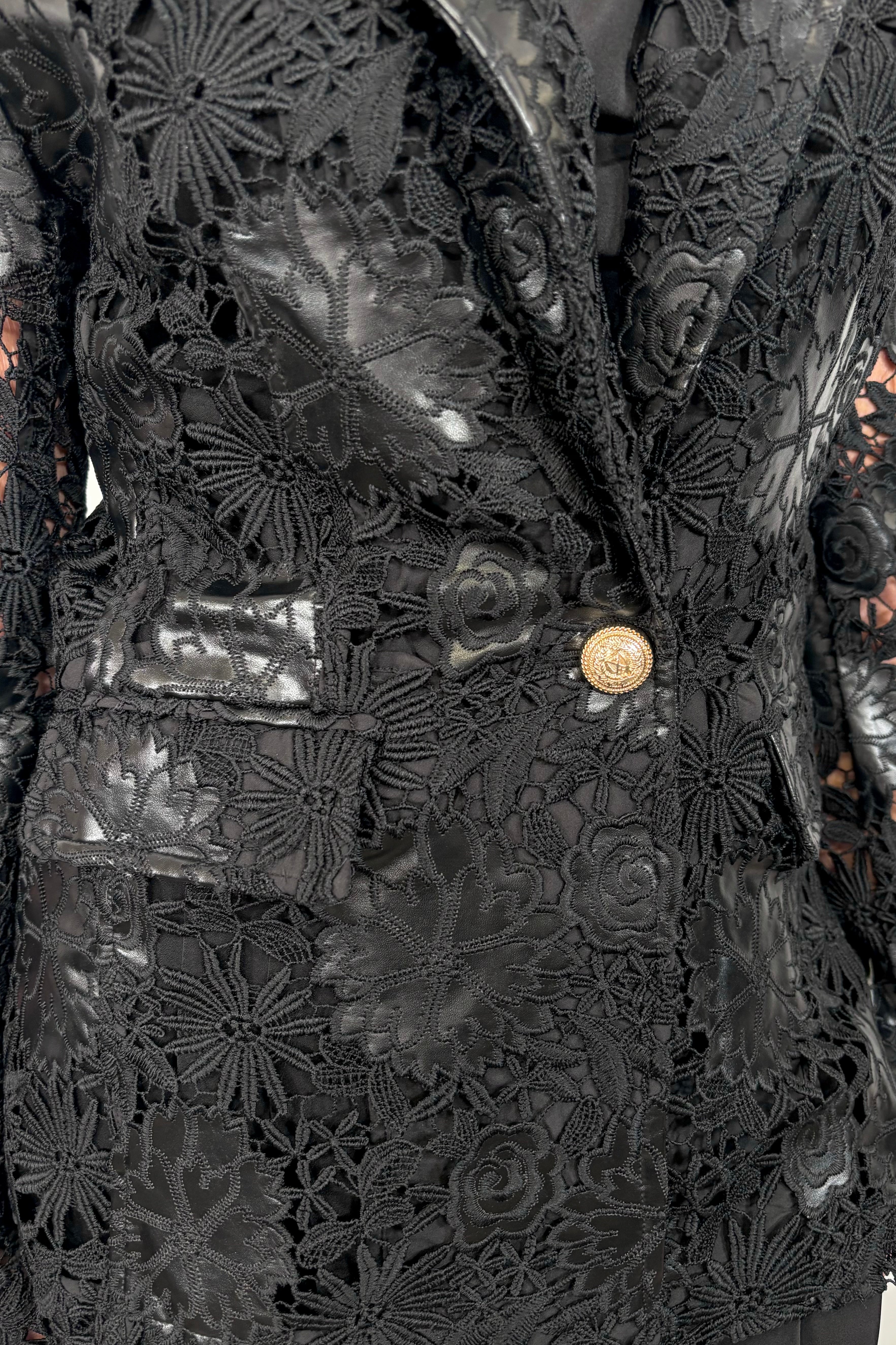 Close-up of a vegan leather lace blazer