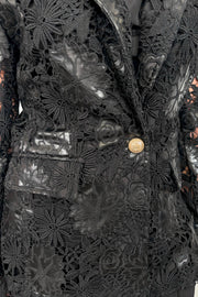 Close-up of a vegan leather lace blazer