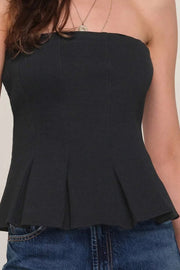 Close up  of  black pleaded at the bottom strapless top