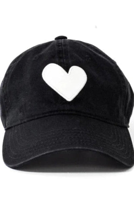 Black cap with a white heart on a white background