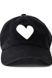 Black cap with a white heart on a white background