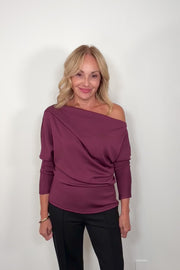 Video of woman wearing a soft cowl neck rouched long sleeve top in merlot