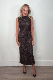 Video of a woman wearing a leopard brown mesh dress
