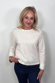 video of woman wearing a cashmere long sleeve white shirt