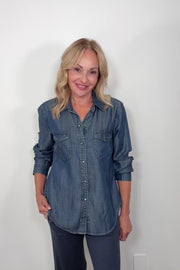 Video of woman wearing a western snap blue shirt
