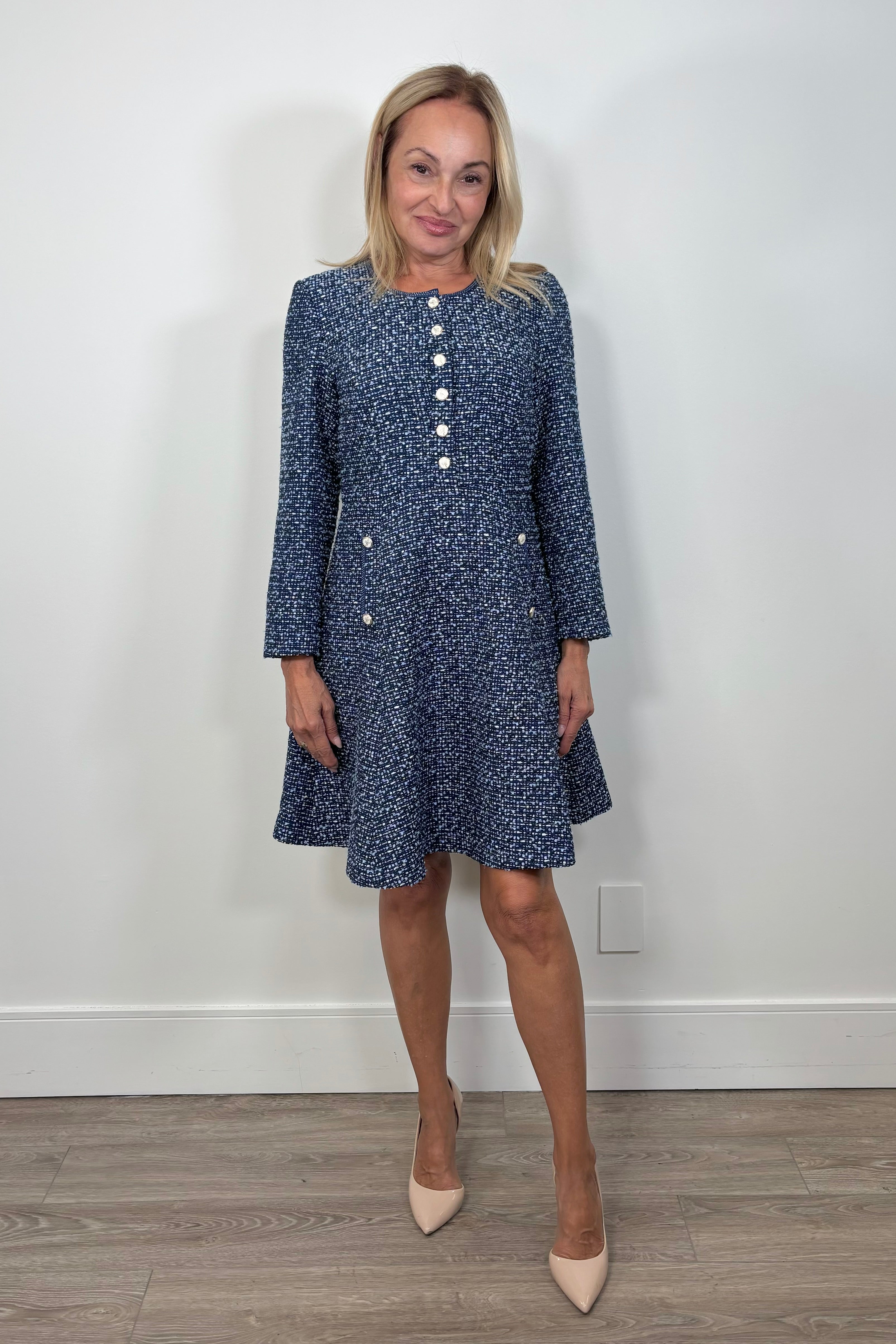 Front view of woman wearing a blue tweed short dress