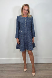 Front view of woman wearing a blue tweed short dress