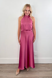 Woman wearing a pink sleeveless satin dress