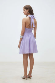 Lavender sleeveless mini dress with a V-neckline, fitted waist, and softly flared skirt, back