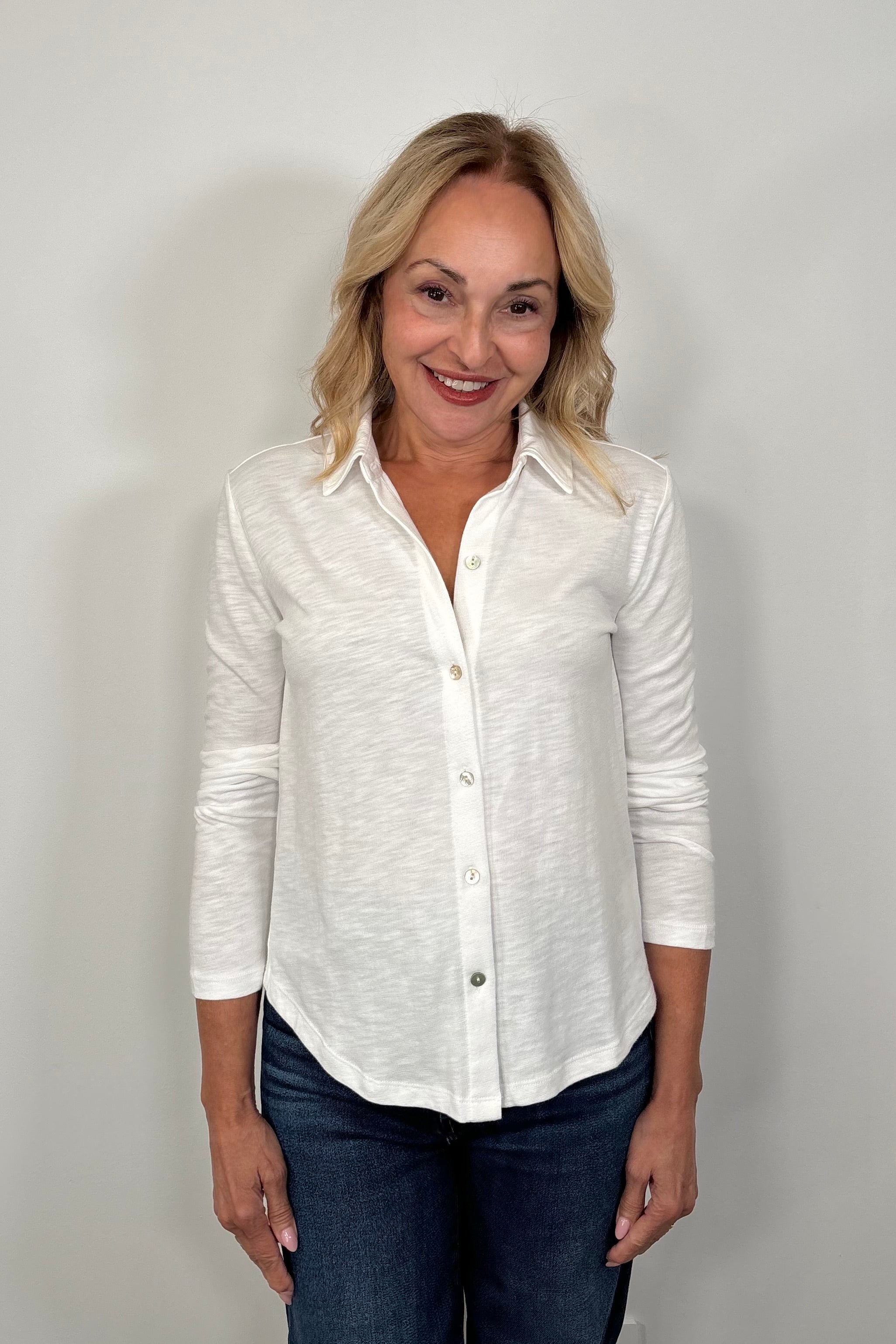 woman wearing a white knit slub shirt