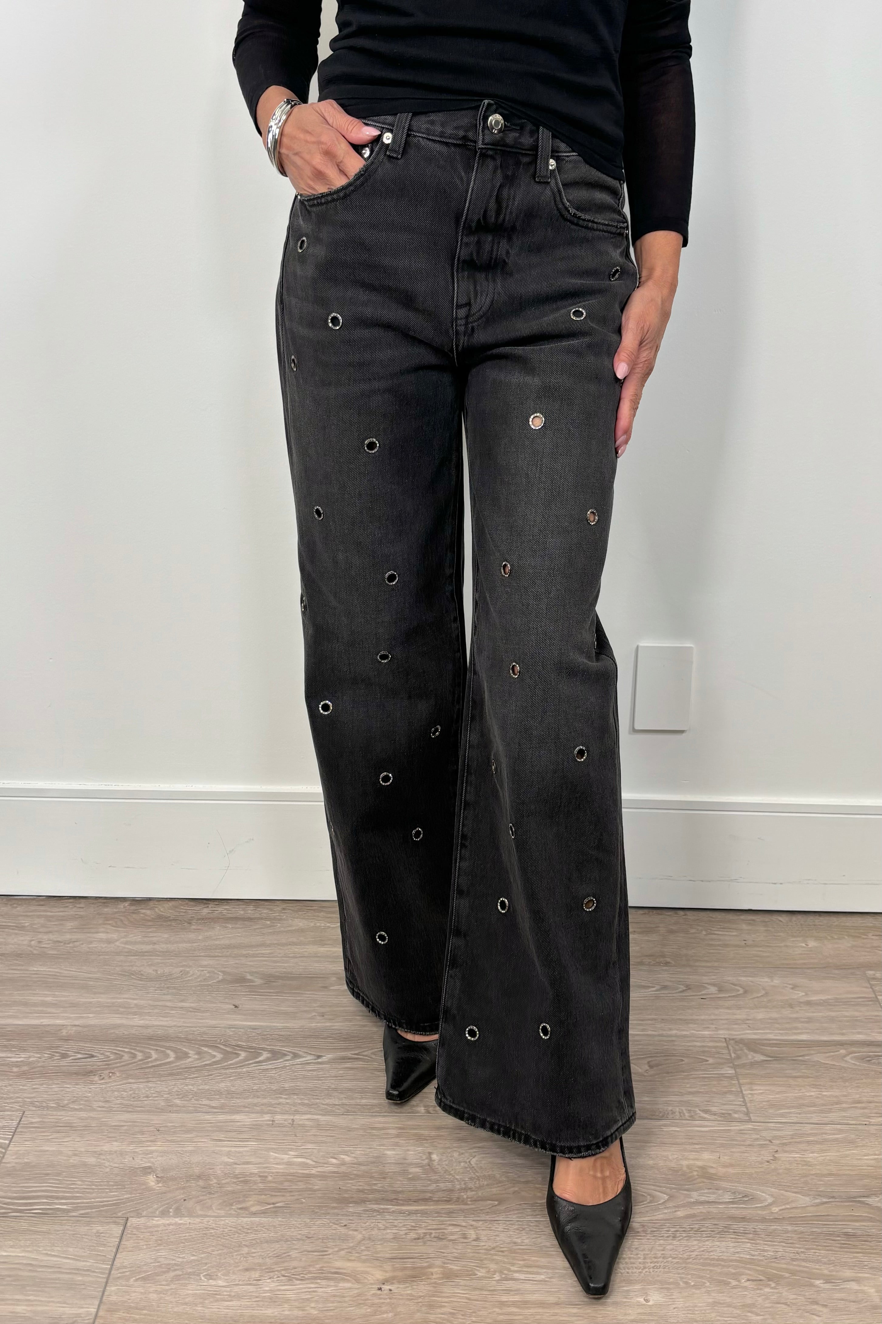 woman wearing washed black baggy jeans