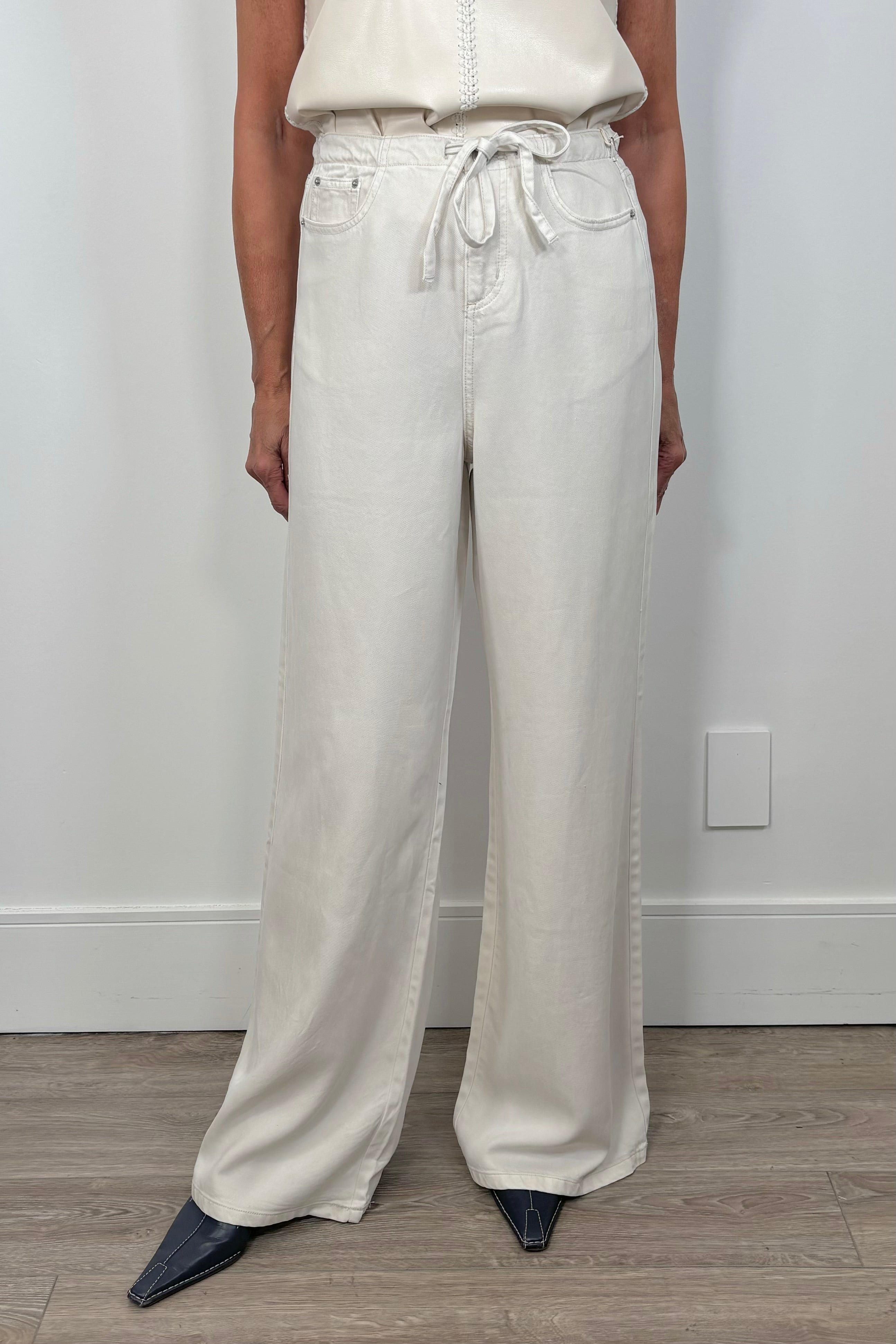 Front view of a white denim pant
