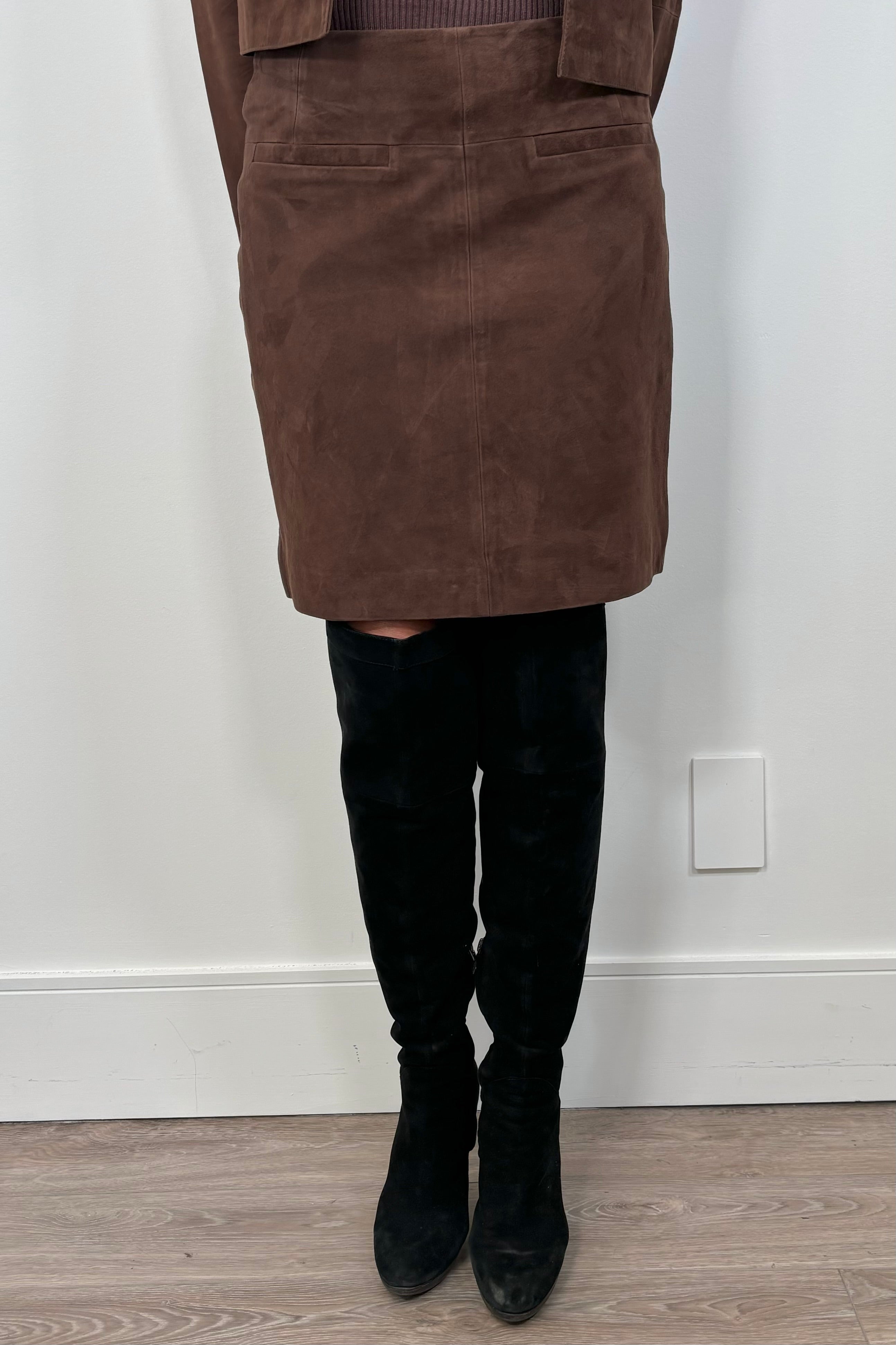 woman wearing a brown short suede leather skirt