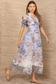 Woman wearing a blue floral patterned dress