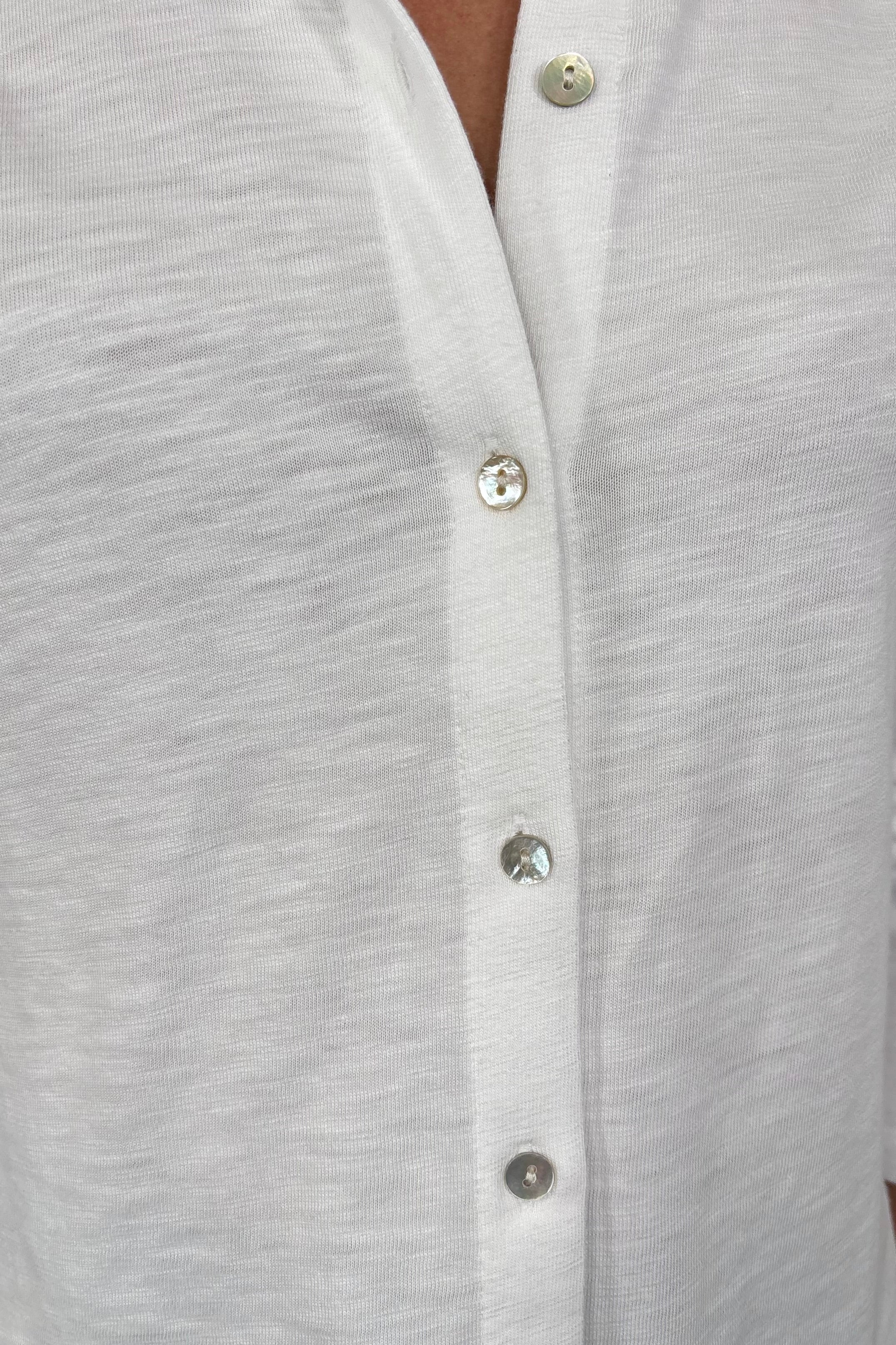 Close-up of a white knit slub shirt