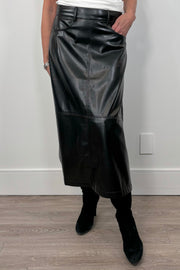 woman wearing a black faux leather skirt