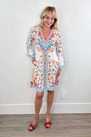 Woman wearing a colorful floral v-neck dress 