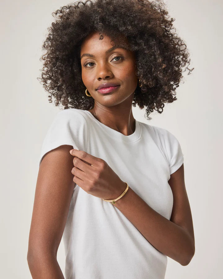 Woman wearing a white crewneck tee shirt close up