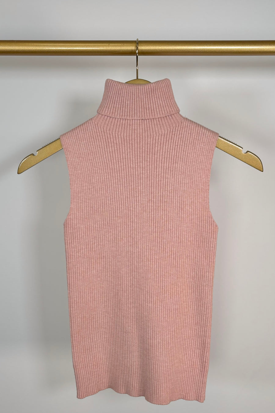 Front view of pink knitted turtleneck tank top
