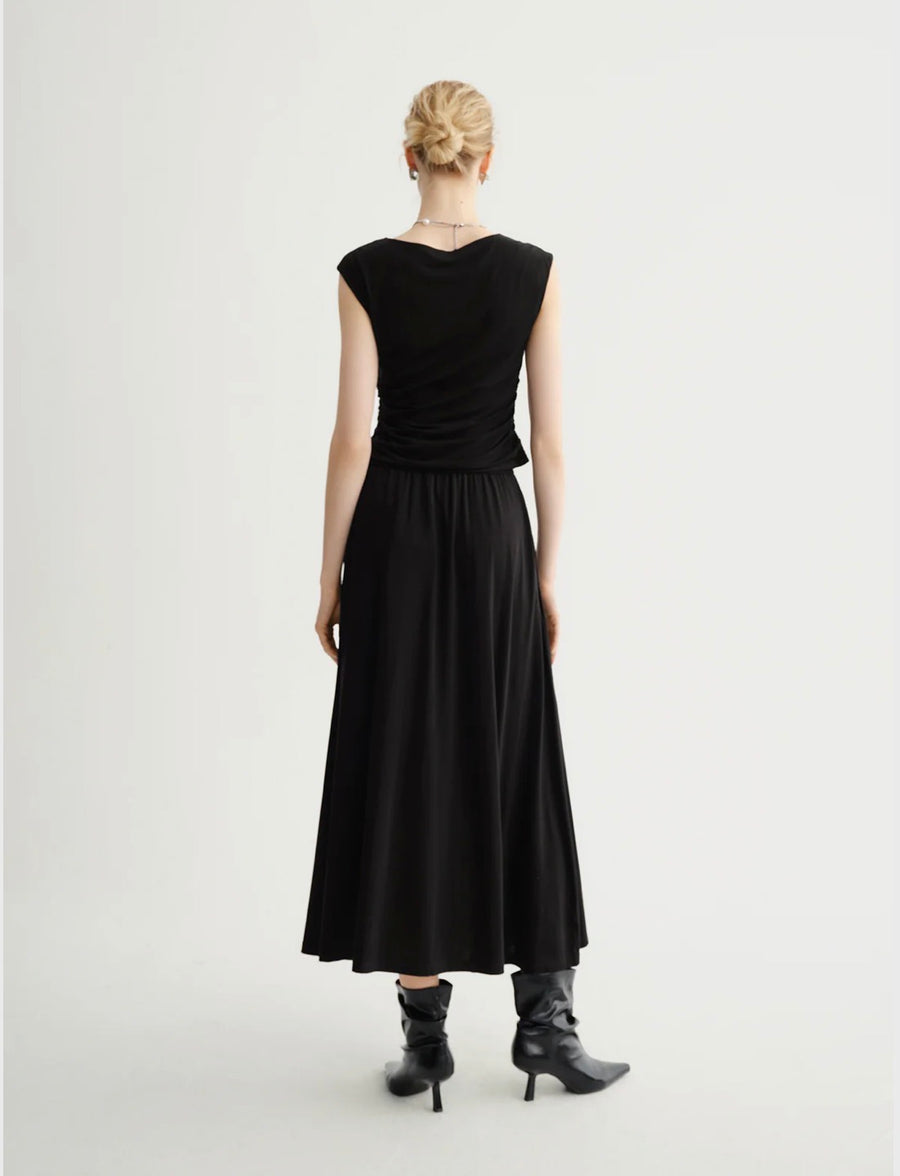 Back view of Woman wearing a black wide shoulder tank top
