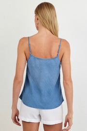 Back view of woman wearing a light indigo blue tank top