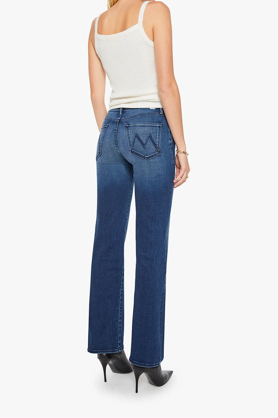 model wearing high waist straight leg blur jeans