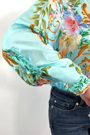 Close-up of a teal regency printed button down shirt