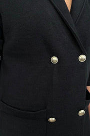 close-up of a black sweater blazer