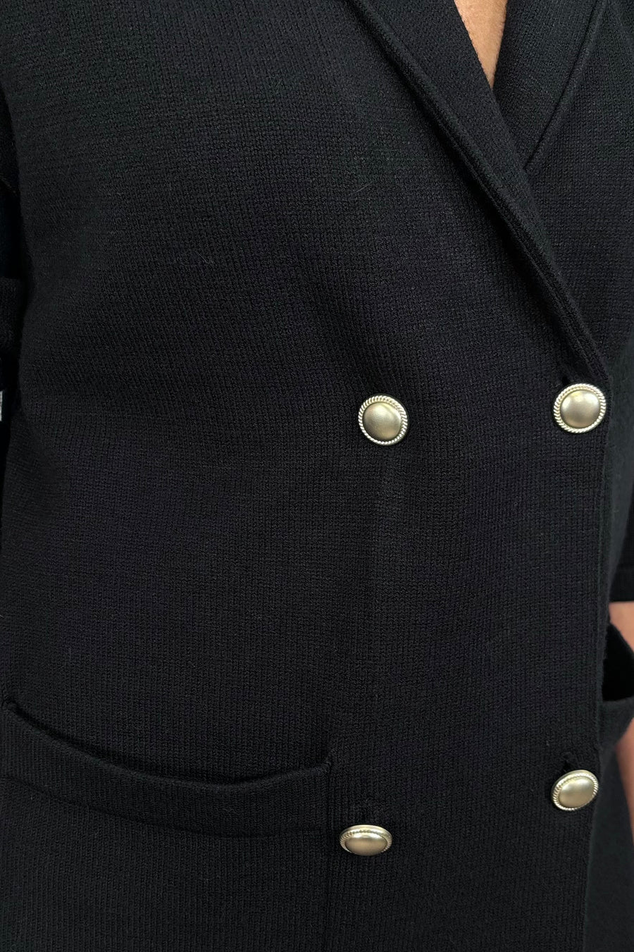 close-up of a black sweater blazer