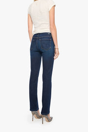 Woman wearing blue jeans and a white top on a white background