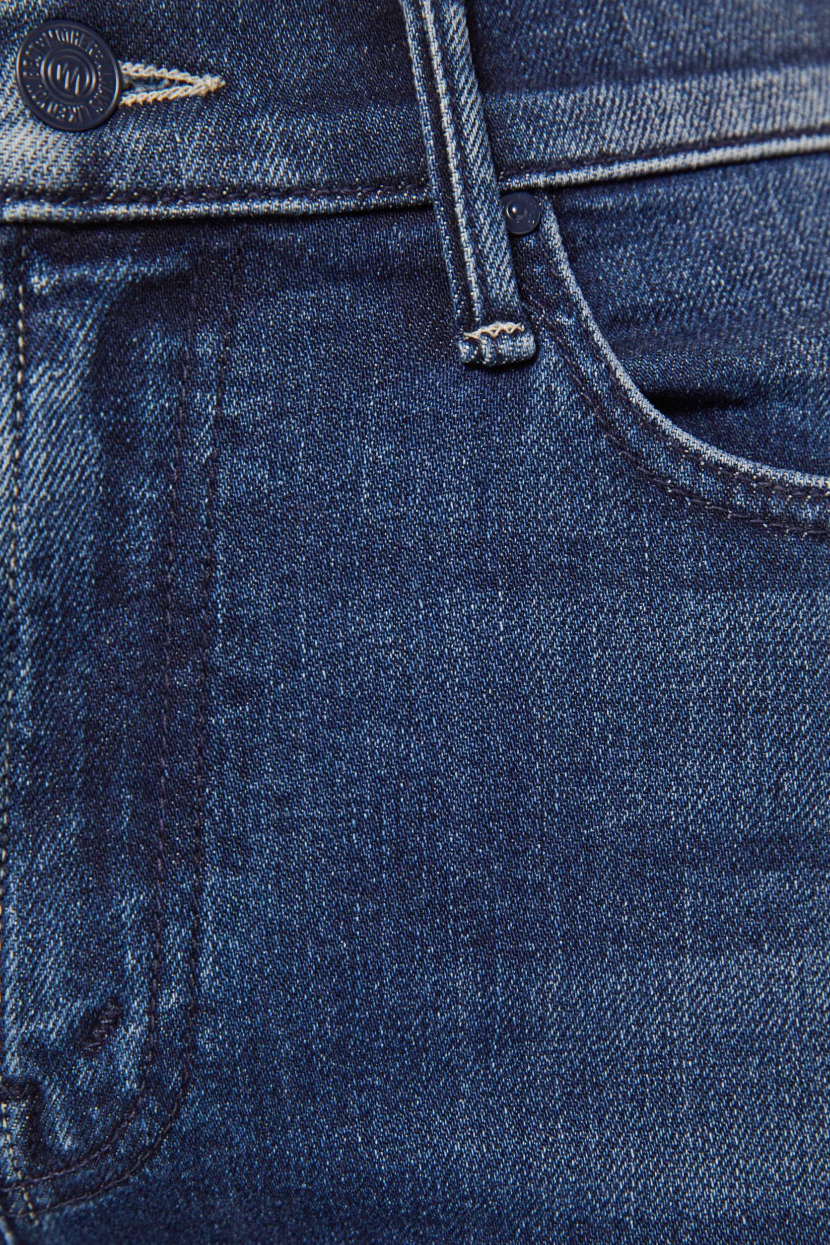 Close-up of blue denim jeans with stitching details