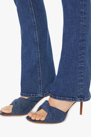 Close-up of the flare of blue jeans