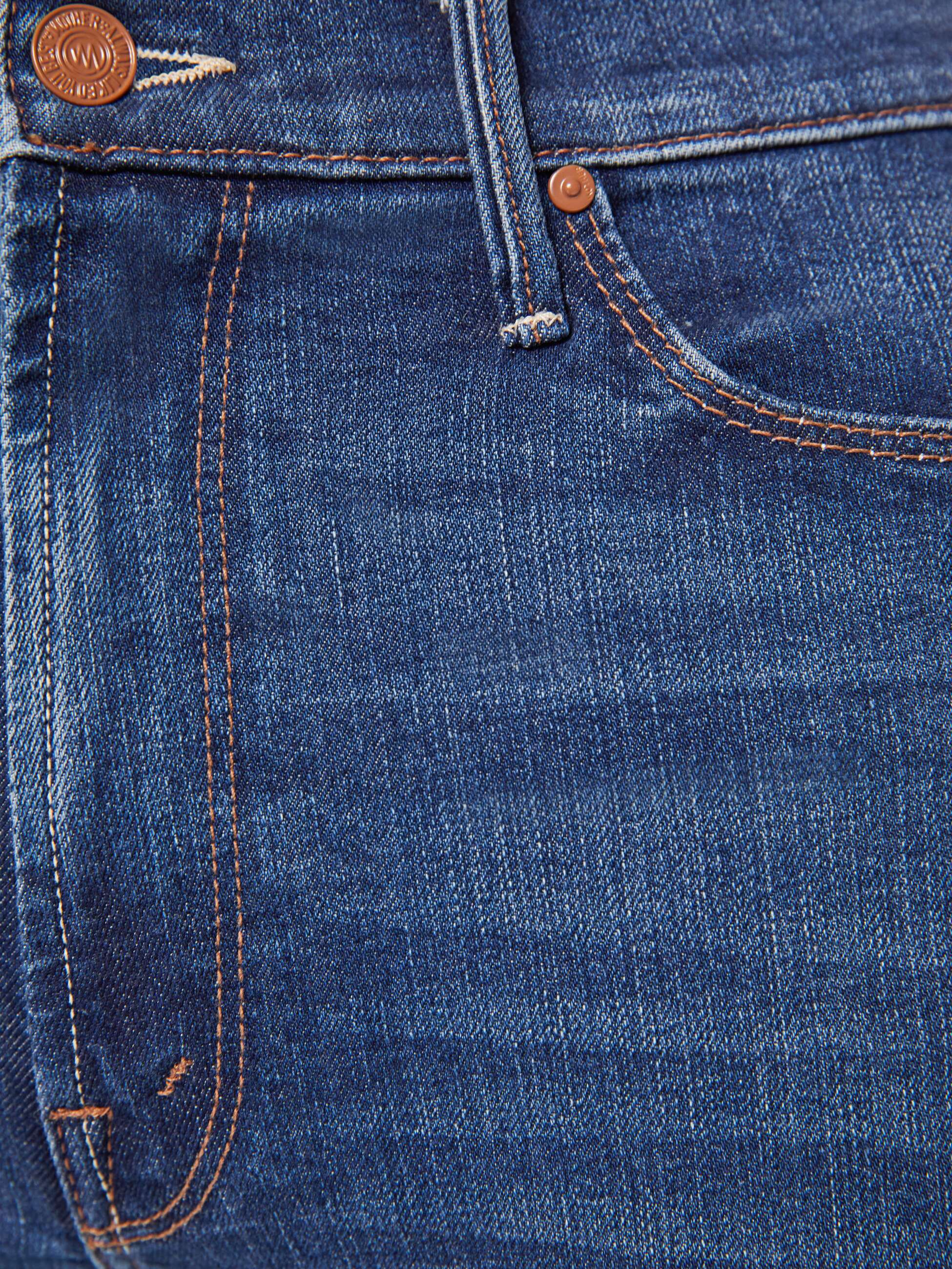 Close-up of blue denim jeans with stitching details
