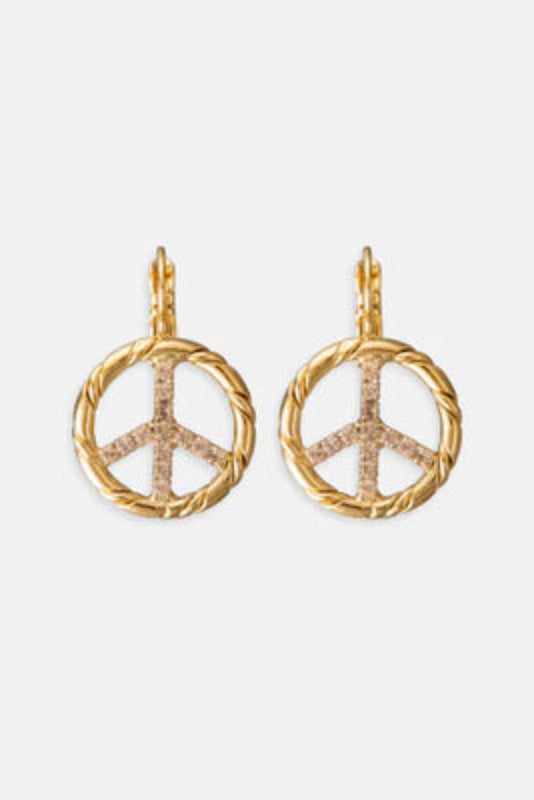 Gold peace sign earrings on a white background