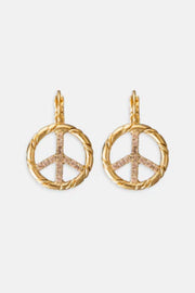 Gold peace sign earrings on a white background