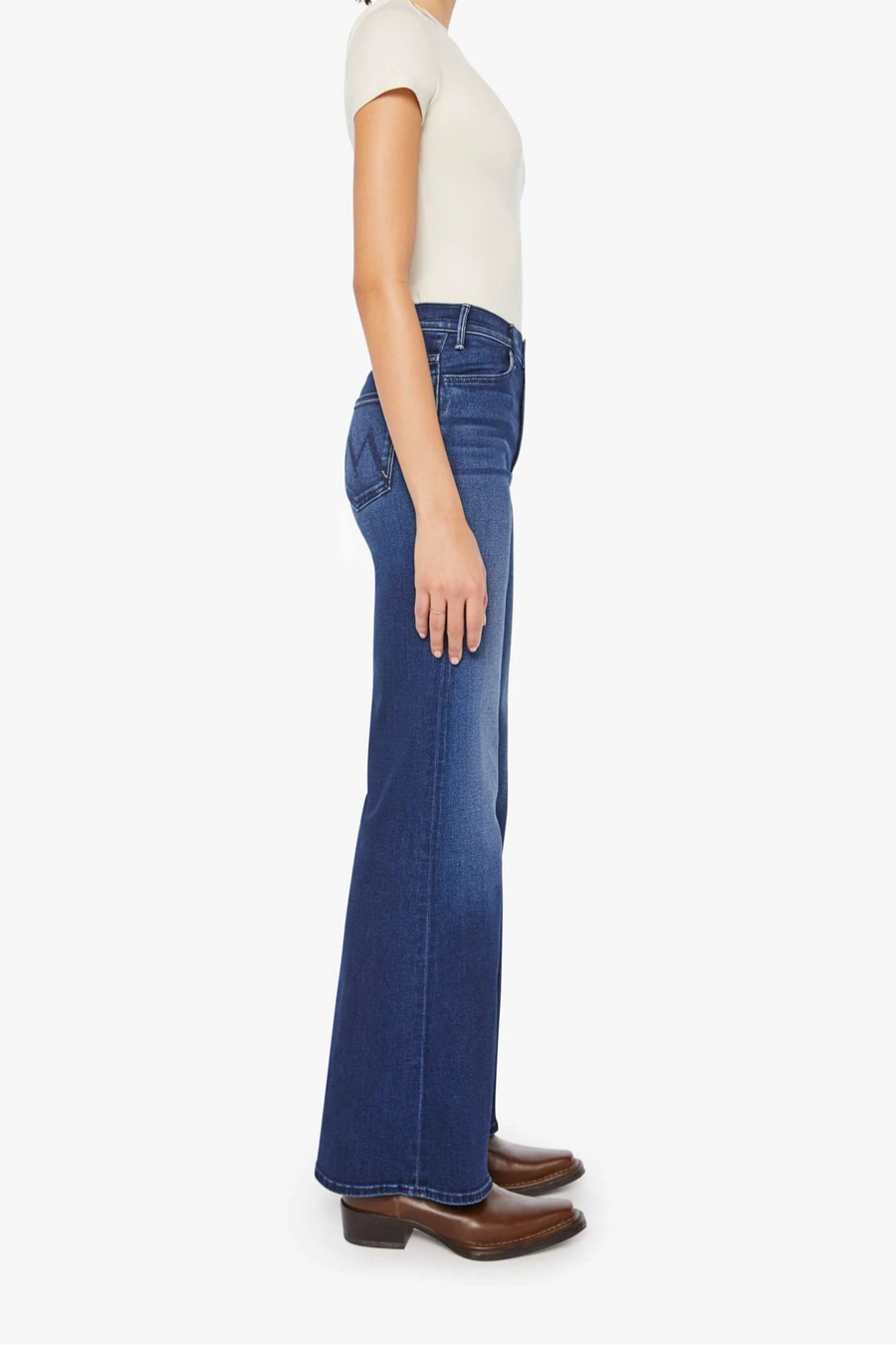 Front view of a person wearing a blue, wide leg, high rise, and clean hem jean