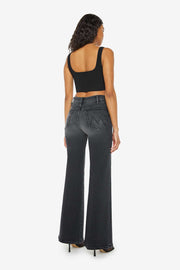 Back view of a person wearing a washed black, wide leg, high rise, and clean hem jean